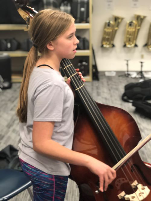 Abby Brinkmann playing the String Bass